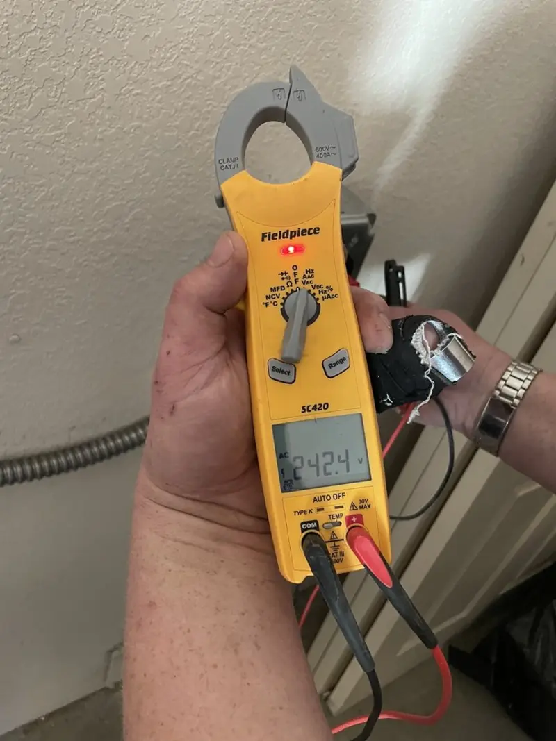 Voltage testing with clamp meter during Outlet Installation in Chamberlayne